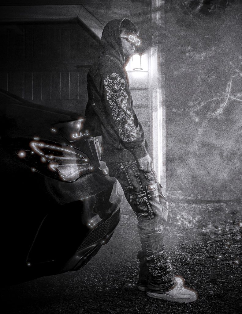 Emerald Eyes visual language: Grayson Murray by his car in EE, 1 of 3